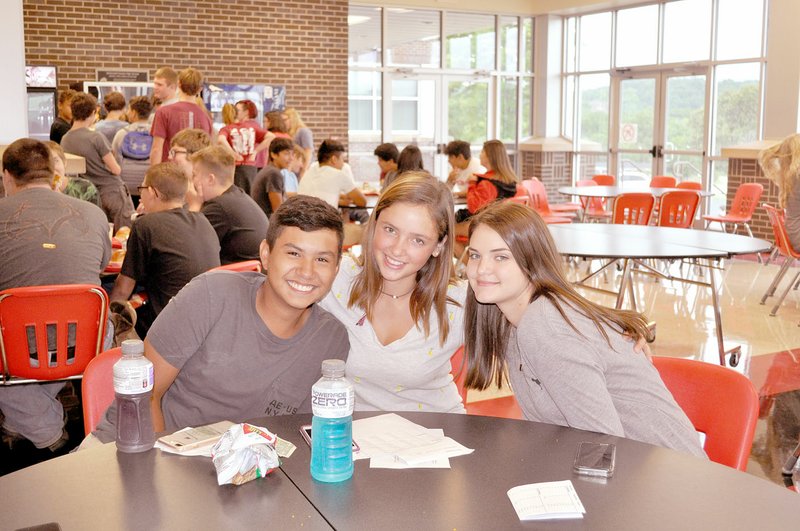 RACHEL DICKERSON/MCDONALD COUNTY PRESS Matthew Mora (left), Hailey Staib and Reese Walsh take their lunch break during freshman academy at McDonald County High School on Tuesday.