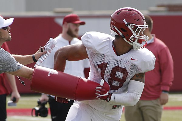 University of Arkansas Razorback tight end Jeremy Patton runs through drills Wednesday, August 8, 2018, during football practice on campus in Fayetteville.