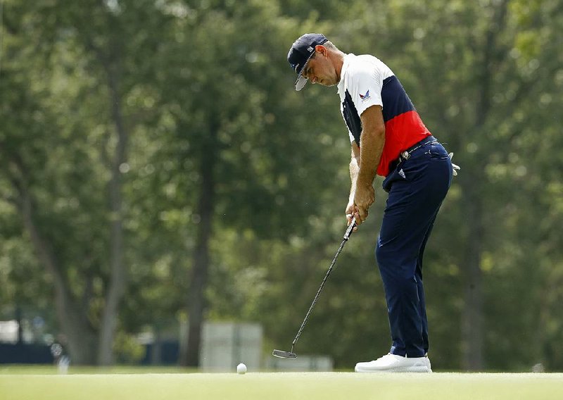Gary Woodland bounced back from an opening bogey to shoot a 6-under 64 to take the lead at the PGA Championship on Thursday at Bellerive Country Club in St. Louis.