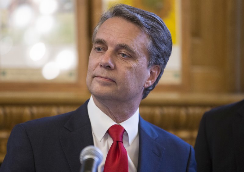 Kansas Governor Jeff Colyer talks to reporters in Topeka, Kan., on Wednesday, Aug. 8, 2018, a day after his primary race against Kansas Secretary of State Kris Kobach. (Travis Heying/The Wichita Eagle via AP)