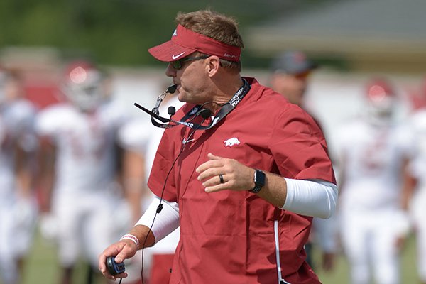 Arkansas coach Chad Morris directs his players Thursday, Aug. 9, 2018, during practice at the university's practice facility in Fayetteville.
