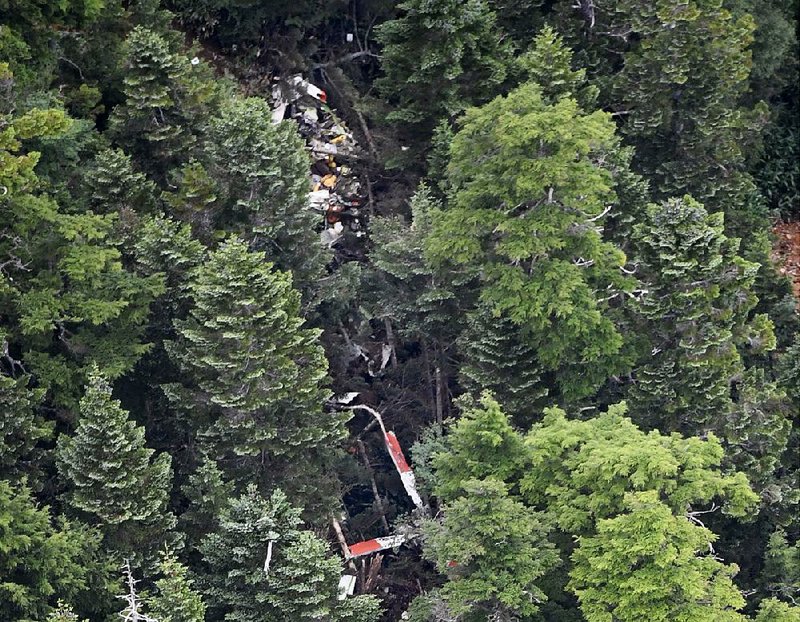 The wreckage of a rescue helicopter was scattered on a mountainside after it crashed Friday in Gunma prefecture northwest of Tokyo.  