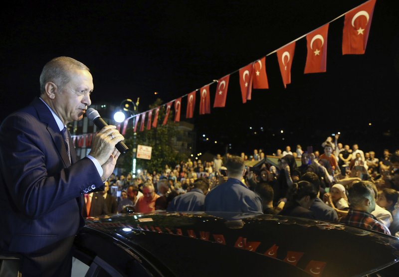 Turkey's President Recep Tayyip Erdogan addresses supporters at his Black Sea hometown, Guneysu, Turkey, early Friday, Aug. 10, 2018. Turkey's Finance and Treasury Minister Berat Albayrak will reveal a &quot; new economic model &quot; as the Turkish Lira has lost more than 30 percent of its value since the start of the year.(Presidential Press Service via AP, Pool)