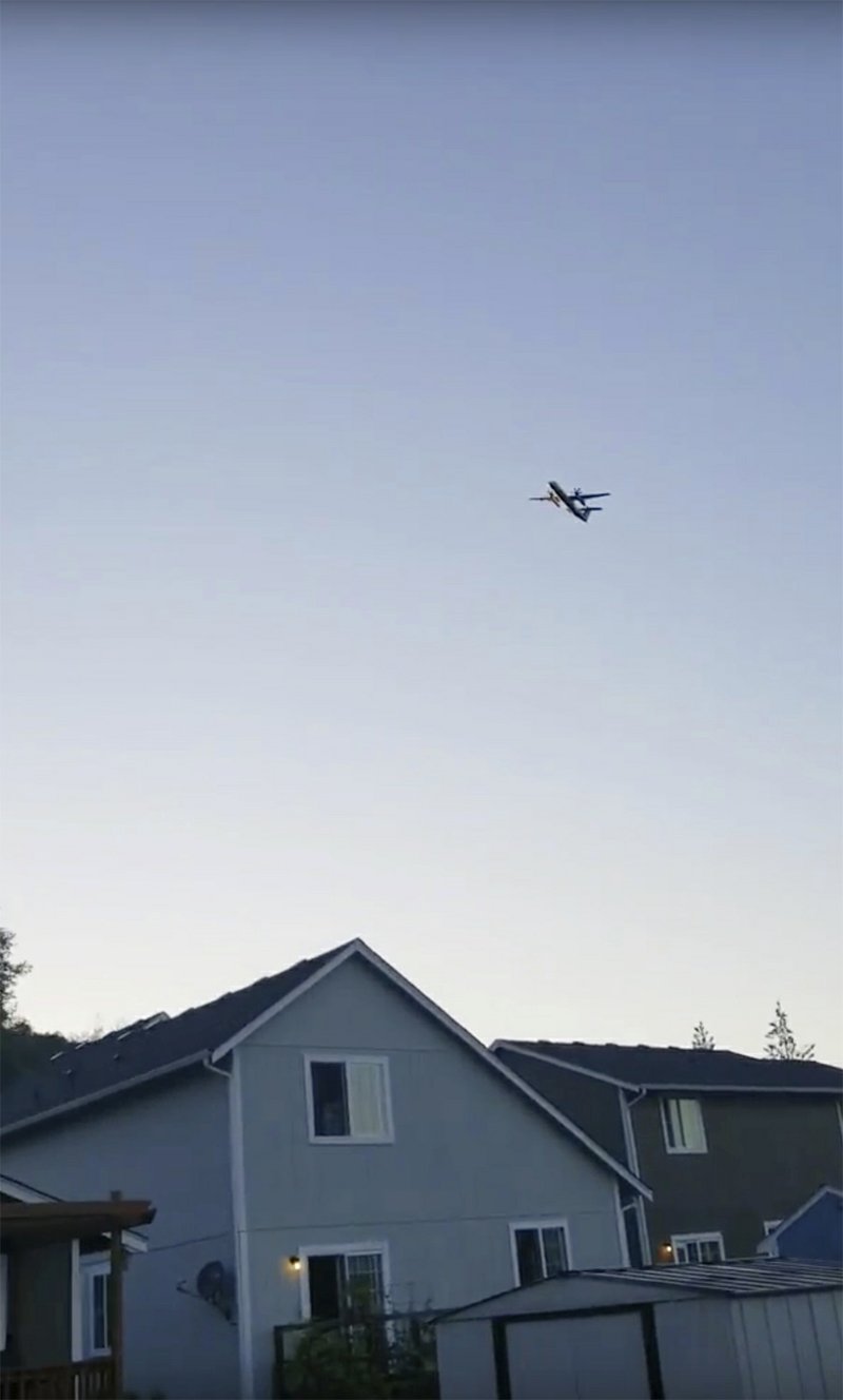 This photo taken from video provided by Courtney Junka shows the stolen Horizon Air turboprop plane flying over Eatonville, Wash., Friday, Aug. 10, 2018. Officials say an airline employee stole an empty Horizon Air turboprop plane with no passengers aboard, and took off from Sea-Tac International Airport in Washington state on Friday night before crashing into a small island. The Pierce County Sheriff's Department says preliminary information suggests the crash occurred because the 29-year-old man was &quot;doing stunts in air or lack of flying skills.&quot; (Courtney Junka via AP)