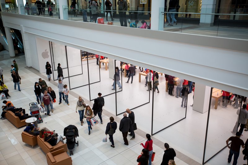 AP Shoppers walk in a mall in Salem, N.H., in April. Second-quarter earnings results for the biggest mall owners in the United States were largely in line with expectations.