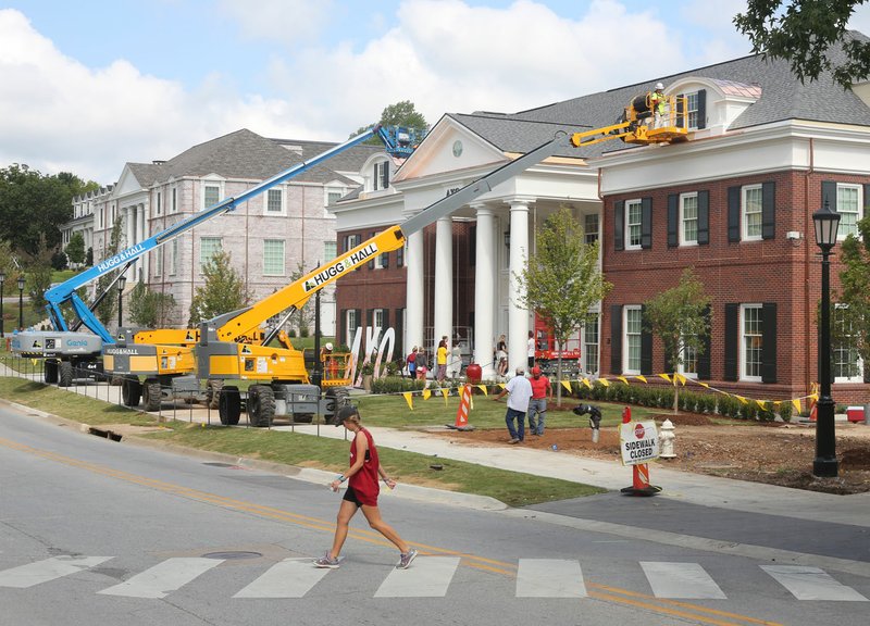 NWA Democrat-Gazette/DAVID GOTTSCHALK Work continues Thursday on the Alpha Chi Omega House at 722 W. Maple St. on the campus of the University of Arkansas in Fayetteville. Four major sorority construction projects including two new houses are finishing up or are ongoing on the campus.