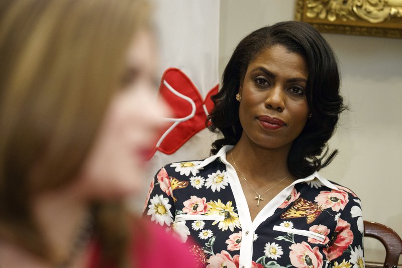 FILE - In this Feb. 14, 2017, file photo, Omarosa Manigault-Newman, then an aide to President Donald Trump, watches during a meeting with parents and teachers in the Roosevelt Room of the White House in Washington. The White House is slamming a new book by ex-staffer Omarosa Manigault-Newman, calling her &#x201c;a disgruntled former White House employee.&#x201d; (AP Photo/Evan Vucci, File)