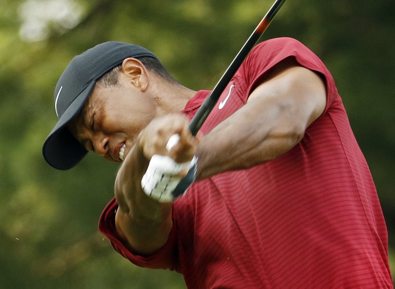 Tiger Woods hits from the 15th tee during the final round of the PGA Championship golf tournament at Bellerive Country Club, Sunday, Aug. 12, 2018, in St. Louis. (AP Photo/Charlie Riedel)