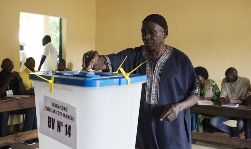 A man casts his ballot during Presidential second round election in Bamako, Mali, Sunday, Aug. 12, 2018. Malians are voting Sunday in a second round presidential election with incumbent Ibrahim Boubacar Keita facing off against opposition leader Soumaila Cisse.(AP Photo/Annie Risemberg)