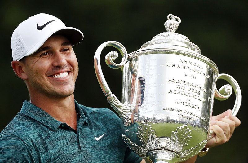 Brooks Koepka holds the Wanamaker Trophy after winning the PGA Championship on Sunday at Bellerive Country Club in St. Louis. Koepka won his second major of the year and third overall. He won the U.S. Open in June.  