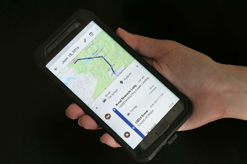 A mobile phone user displays travel information for the New York area in early August. An investiga- tion found that Google services records users’ whereabouts even when settings tell them not to.