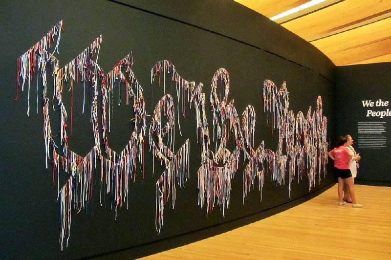 At Crystal Bridges Museum of American Art in Bentonville, the re- designed Early American Art galleries are introduced by a large installation titled “We the People.”