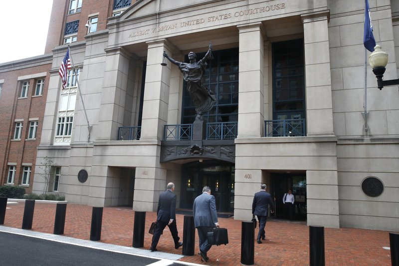 Members of the defense team for Paul Manafort, including Thomas Zehnle (from left), Richard Westling and Kevin Downing, walk to federal court Monday as the trial of the former campaign chairman for President Donald Trump continues in Alexandria, Va. 