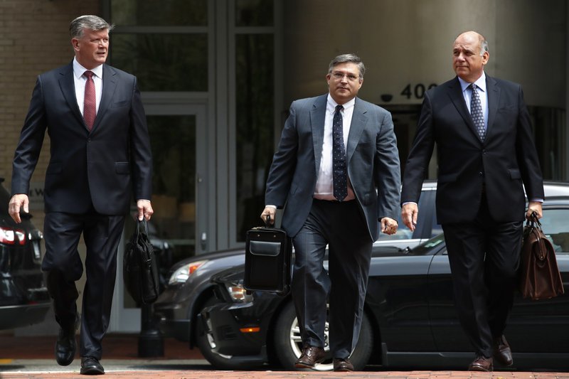 Members of the defense team for Paul Manafort, including Kevin Downing, left, Richard Westling, and Thomas Zehnle, walk to federal court as the trial of the former Trump campaign chairman continues, in Alexandria, Va., Monday, Aug. 13, 2018. The prosecution is expected to rest its case in the fraud trial. (AP Photo/Jacquelyn Martin)