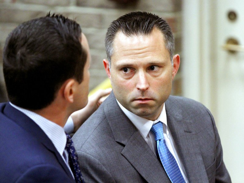 In this June 12, 2018, file photo, Thomas Tramaglini, right, the Kenilworth Schools superintendent accused of defecating on the track at Holmdel High School, makes his initial appearance in Holmdel Municipal Court in Holmdel, N.J. 