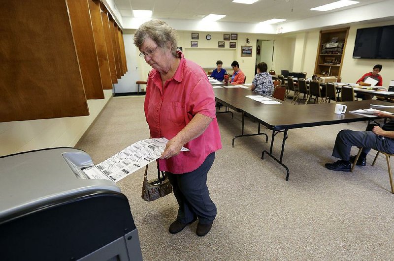 Paula Nicholson casts her ballot Tuesday in rural Kieler, Wis., in the state’s primary elections. Wisconsin was one of four states with primaries Tuesday, seen as a measure of the strength of President Donald Trump’s coalition against the energy of Democratic voters. 
