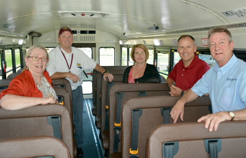 Janelle Jessen/Herald-Leader School board members toured the district's newest special needs bus before Thursday's meeting. Pictured are board member Connie Matchell, transportation director Steve Avery, and board members Audra Farrell, Roger Holroyd and Brian Lamb.