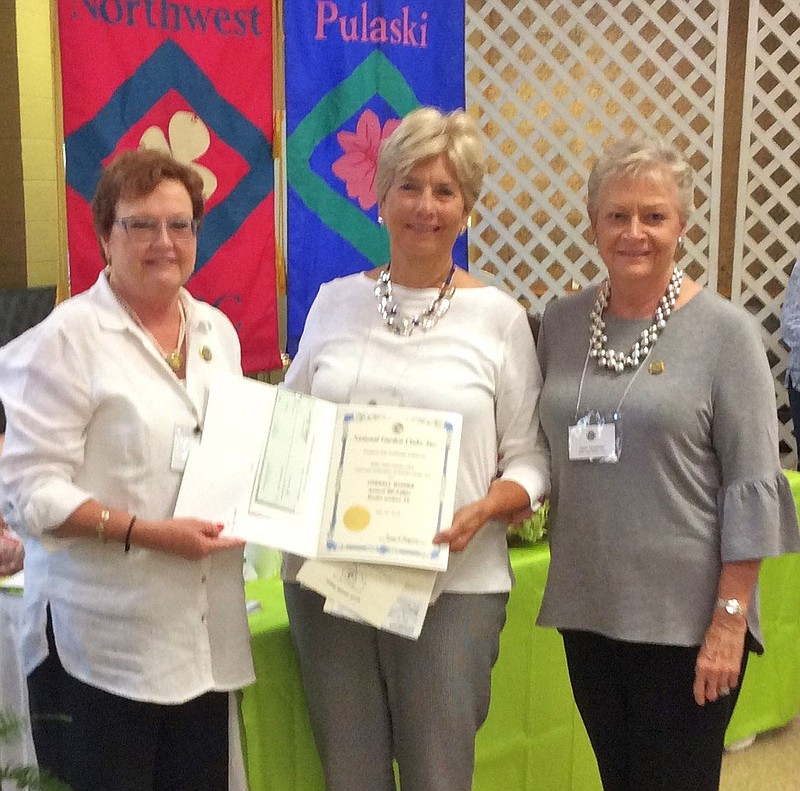 Courtesy photo Pictured receiving their award from Arkansas Federation of Garden Clubs President Derenda Stanley (left) is BVGC President Judy Jeffrey and BVGC Past President and TV Producer Geri Hoerner.