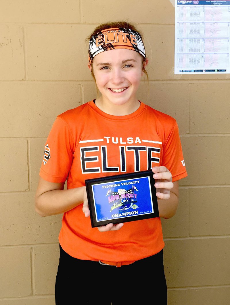 Submitted photo Brinkley Moreton, 12, of Lincoln, poses with her National Championship pitching velocity plaque. She threw 56 m.p.h. Brinkley is the daughter of Dax and Christina Moreton, of Lincoln.