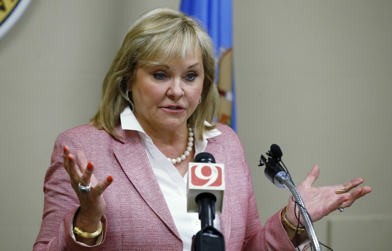 In this July 30, 2018, file photo, Oklahoma Gov. Mary Fallin speaks at a meeting in Oklahoma City. Fallin said Tuesday, Aug. 14, 2018, that Nevada-based Valkyrie Systems Aerospace has formed a partnership with the state to operate manufacturing facilities as well as flight operations and training in the Oklahoma City area.  (AP Photo/Sue Ogrocki, File)