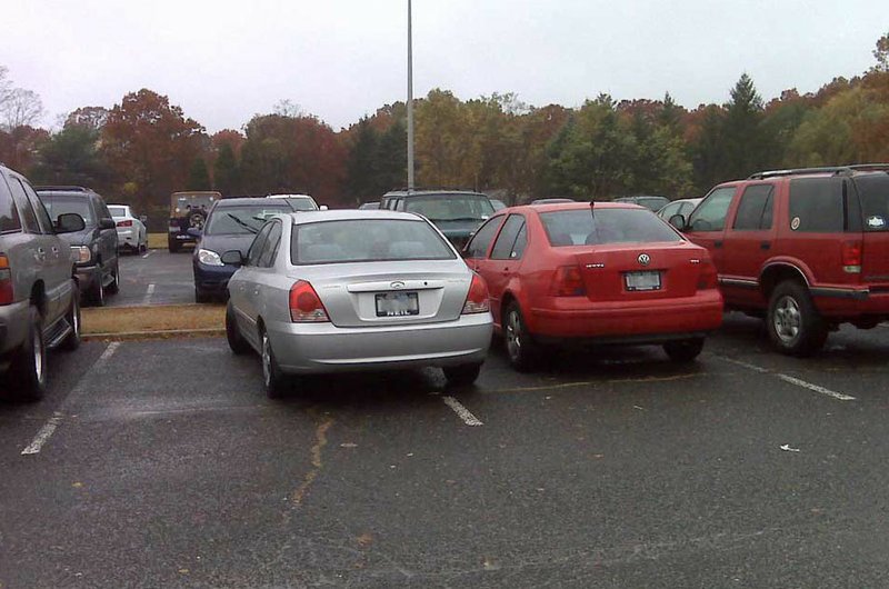Courtesy Photo Straddling the white parking-space lines
