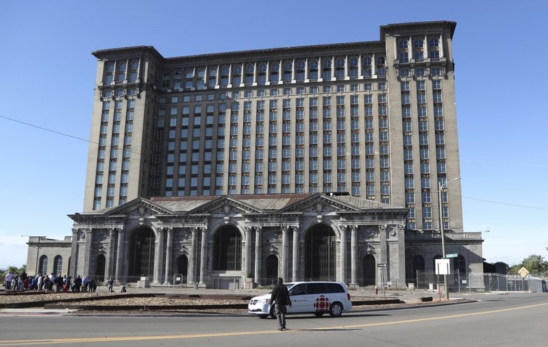 This Monday, June 11, 2018, photo shows the historic Michigan Central Station in Detroit. Ford Motor Co. said Tuesday, Aug. 14, 2018, it plans to spend roughly $740 million renovating Detroit's long vacant train depot and redeveloping other area properties for research and development of self-driving vehicles. (AP Photo/Carlos Osorio, File)