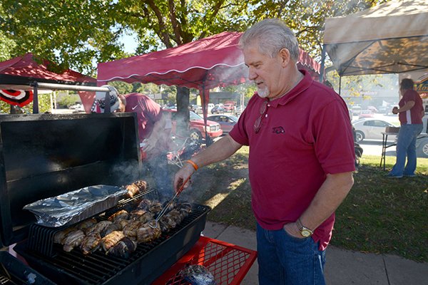 Larry Spencer of Eagle Rock, Mo. grills on Saturday Oct. 8, 2016 while tailgating before the Razorbacks' football game against Alabama at Razorback Stadium in Fayetteville.
