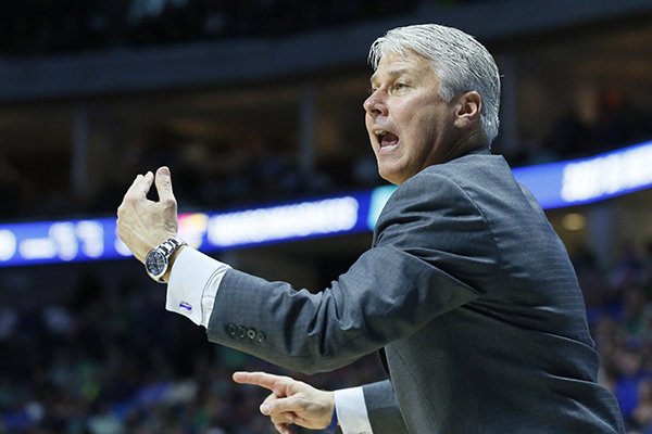 UC Davis head coach Jim Les gestures to his team in the first half of a first-round game against Kansas in the men's NCAA college basketball tournament in Tulsa, Okla., Friday, March 17, 2017. (AP Photo/Sue Ogrocki)

