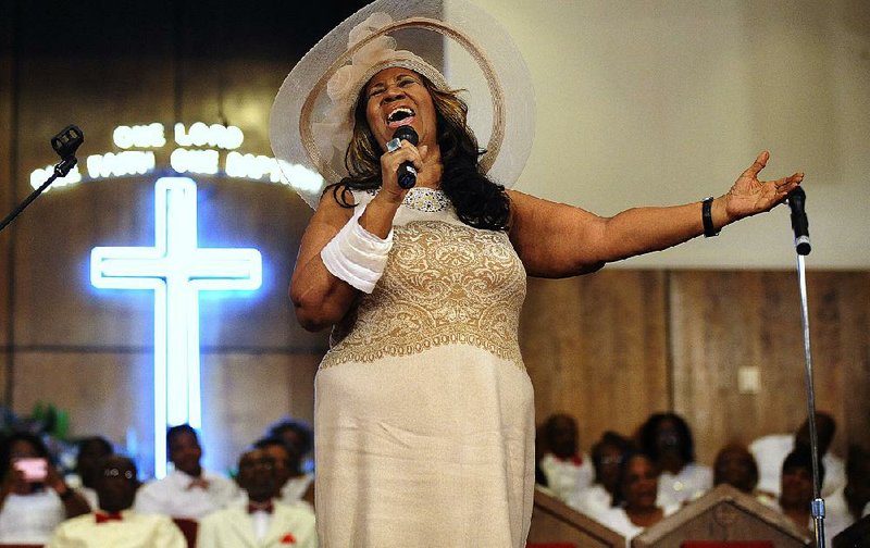 Aretha Franklin sings at a June 2015 memorial service for her father and brother, who both died in the 1980s, at the Detroit church where they served as ministers and where Franklin learned to sing the gospel style that led to her career and made her an institution in soul music. 