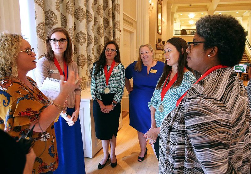 Meghan Ables (left), 2016 Arkansas Teacher of the Year, talks Thursday with semifinalists for the award after the 2019 state Teacher of the Year recognition event at the Governor’s Mansion in Little Rock. Pictured (from left of Ables) are semifinalists Chrystal Burkes of Bryant and Candace Wilson of Sheridan; Randi House, 2018 Arkansas Teacher of the Year; and semifinalists Vanessa Stewart of Springdale and Stacey McAdoo of Little Rock.  