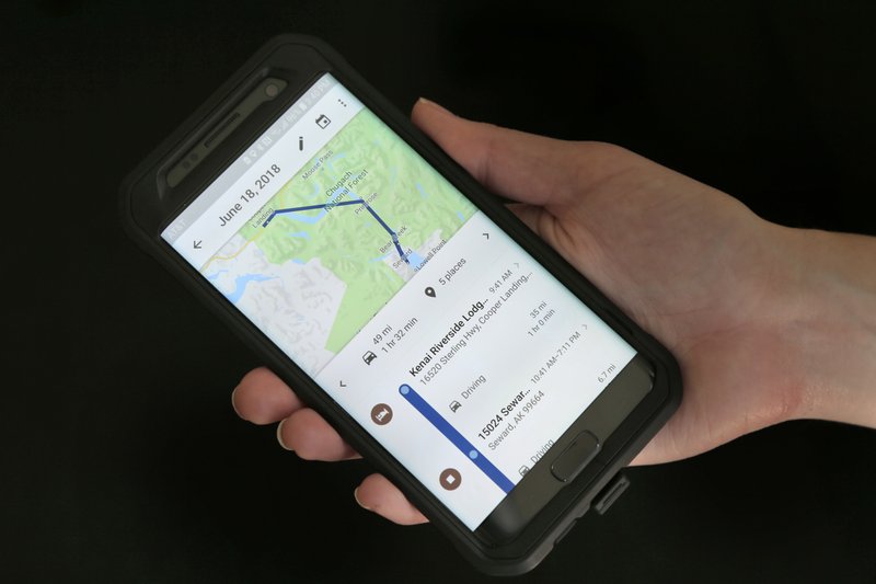 FILE- In this Aug. 8, 2018, file photo a mobile phone displays a user's travels using Google Maps in New York. Days after an Associated Press investigation revealed that Google is storing the locations of users even if they turn a privacy setting called "Location History" off, the company has changed a help page that erroneously described how the setting works. (AP Photo/Seth Wenig, File)