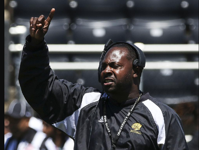 Coach Cedric Thomas calls a play during the University of Arkansas at Pine Bluff’s spring football game in April.