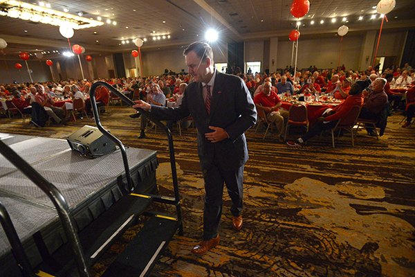 Arkansas coach Chad Morris walks onto the stage Friday, Aug. 17, 2018, as he is introduced during the annual Kickoff Luncheon at the Northwest Arkansas Convention Center in Springdale.