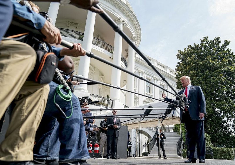 Speaking to reporters Friday before leaving the White House for a fundraiser in Southampton, N.Y., President Donald Trump called Justice Department official Bruce Ohr, a frequent target of Trump criticism, “a disgrace.” 