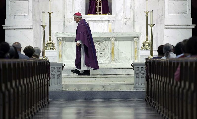 Bishop Ronald Gainer celebrates Mass on Friday at Cathedral Church of Saint Patrick in Harrisburg, Pa. The grand jury report released this week criticized Gainer for advocating to the Vatican that two abusive priests not be defrocked.  
