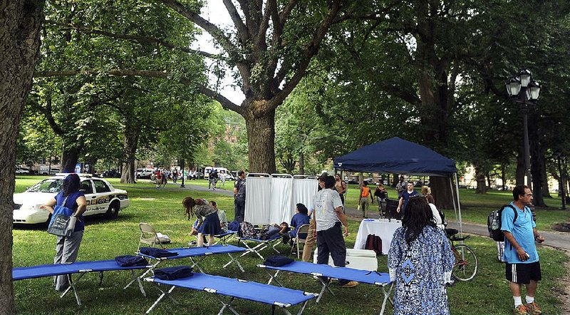 Cots were set up as a makeshift treatment center on New Haven Green in New Haven, Conn., to deal with a stream of drug overdoses.  