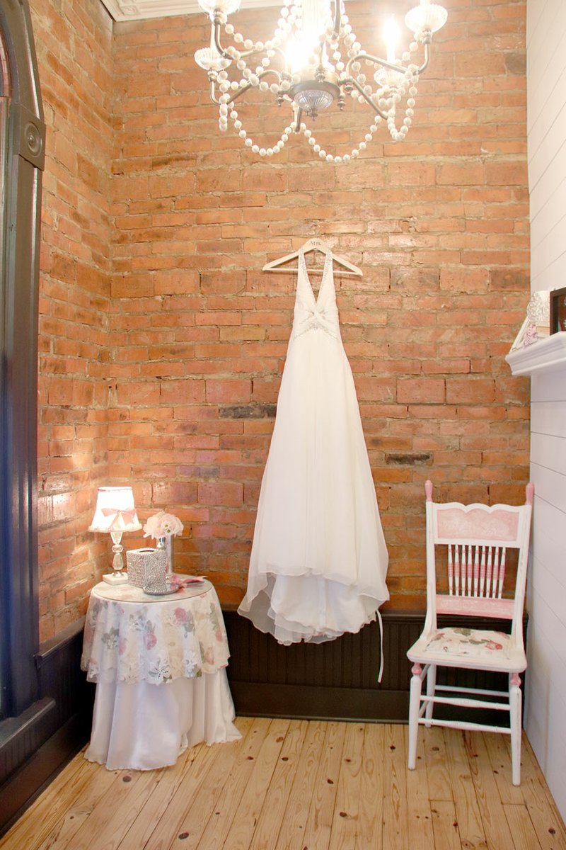 LYNN KUTTER ENTERPRISE-LEADER Plaster was removed during the renovation to reveal this original brick wall in what is now the bride's room.