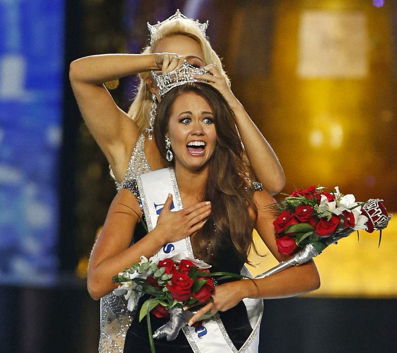 FILE &#x2013; In this Sept. 10, 2017, file photo, Miss North Dakota Cara Mund reacts after being named Miss America during the Miss America 2018 pageant in Atlantic City, N.J. In a letter sent to former Miss Americas on Friday, Aug. 17, 2018, Mund says she has been bullied, manipulated and silenced by the pageant's current leadership, including chairwoman Gretchen Carlson. (AP Photo/Noah K. Murray, File)