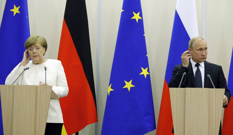 In this May 18, 2018 file photo Russian President Vladimir Putin, right, and German Chancellor Angela Merkel attend news conference after their meeting at Putin's residence in the Russian Black Sea resort of Sochi, Russia. Merkel and Putin will meet on Saturday in the German government's guesthouse Meseberg, north of Berlin, Saturday, Aug. 18, 2018. The topics will include the civil war in Syria, the conflict in Ukraine, and energy questions. (AP Photo/Alexander Zemlianichenko, file)