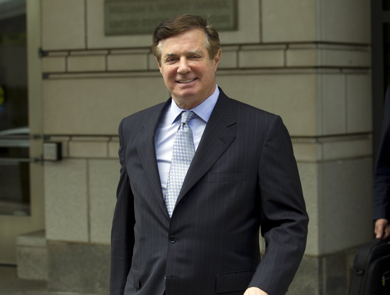 FILE - In this May 23, 2018, file photo, Paul Manafort, President Donald Trump's former campaign chairman, leaves the Federal District Court after a hearing, in Washington. As jurors weigh Manafort&#x2019;s fate in a sprawling financial fraud case taking place in Alexandria, Va., Manafort still has another, separate trial looming in the nation&#x2019;s capital. Neither case involves allegations of Russian election interference or possible coordination by the Trump campaign, which are at the heart of Mueller&#x2019;s larger investigation. But President Donald Trump has expressed a keen interest in Manafort&#x2019;s fate as he seeks to publicly undermine Mueller's probe. (AP Photo/Jose Luis Magana, File)