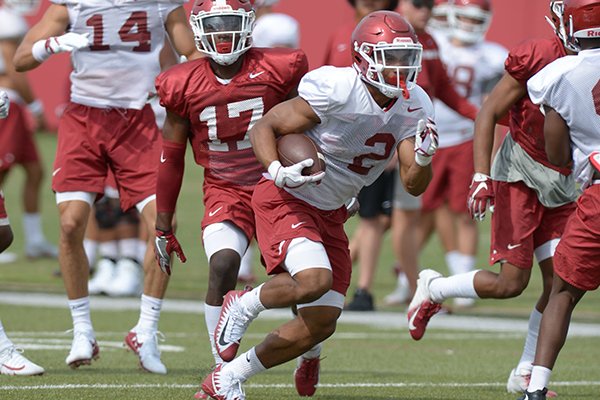 Arkansas running back Chase Hayden (2) carries the ball Tuesday, Aug. 7, 2018, during practice at the university practice fields in Fayetteville. 
