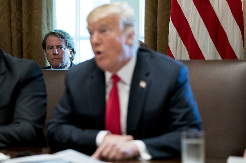 White House counsel Don McGahn listens during a Cabinet meeting Thursday. Fearing President Donald Trump was setting him up for blame, people close to him say, McGahn has been cooperating with the special counsel’s investigation to show he did nothing wrong.