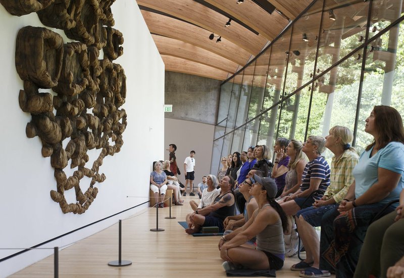 File Photo/CHARLIE KAIJO Participants reflect on a sculpture called "Unraveling" by Ursula Von Rydingsvard during an art meditation event at Crystal Bridges Museum in Bentonville. The session, titled "Meditation and Mindfulness," gives visitors a break from their day to visit Crystal Bridges for rejuvenation in a guided meditation and mindfulness program. See a complete listing of museum offerings at crystalbridges.org.