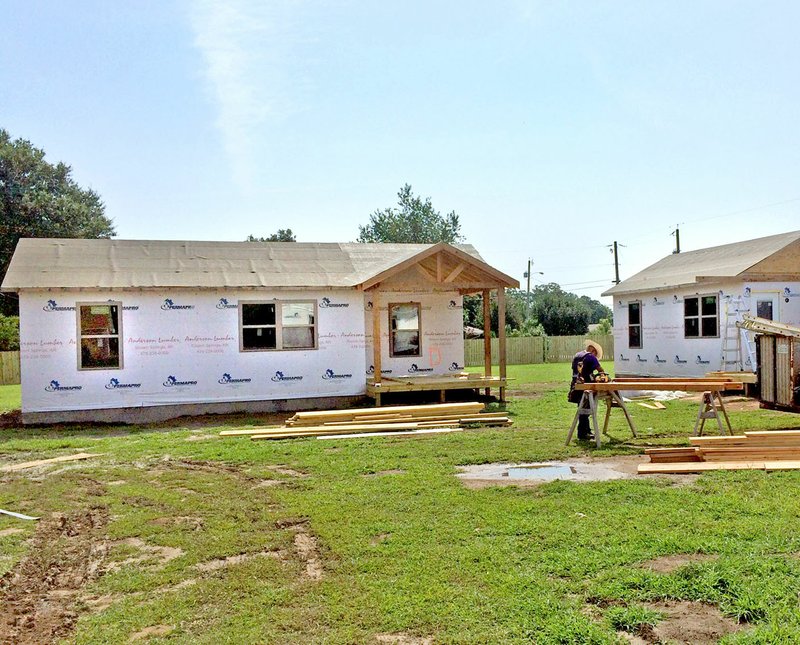 Janelle Jessen/Siloam Sunday Work on the first four tiny houses for the Launchpad housing campus for the homeless are about 70 percent complete. An open house and cookout, hosted by Genesis House, to celebrate the new transitional housing units is planned for Saturday, Aug. 25.
