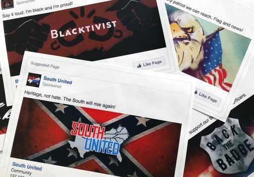FILE - This Nov. 1, 2017, file photo shows some of the Facebook ads linked to a Russian effort to disrupt the American political process and stir up tensions around divisive social issues, released by members of the U.S. House Intelligence committee, are photographed in Washington. Groups tied to the Russian government have been trying to meddle in U.S. politics since at least the 2016 elections. (AP Photo/Jon Elswick, File)