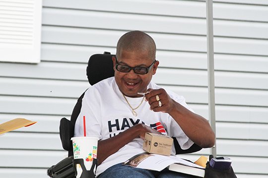 Jerome Fair smiles while holding the key to his new Habitat for Humanity home on Garland&#x201a;&#xc4;&#xe3; Ave. on Saturday August 18. (The Sentinel Record/Rebekah Hedges)