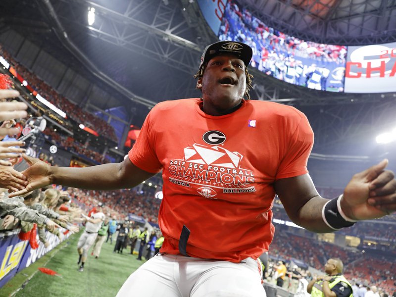 Georgia offensive lineman Isaiah Wilson celebrates a Georgia win over Auburn after the Southeastern Conference championship NCAA college football game, Saturday, Dec. 2, 2017, in Atlanta. Georgia won 28-7. (AP Photo/David Goldman)