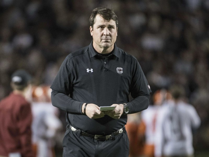 FILE-In this Saturday, Nov. 25, 2017 file photo, South Carolina head coach Will Muschamp watches his players before an NCAA college football game against Clemson, in Columbia, S.C. (AP Photo/Sean Rayford, File)     