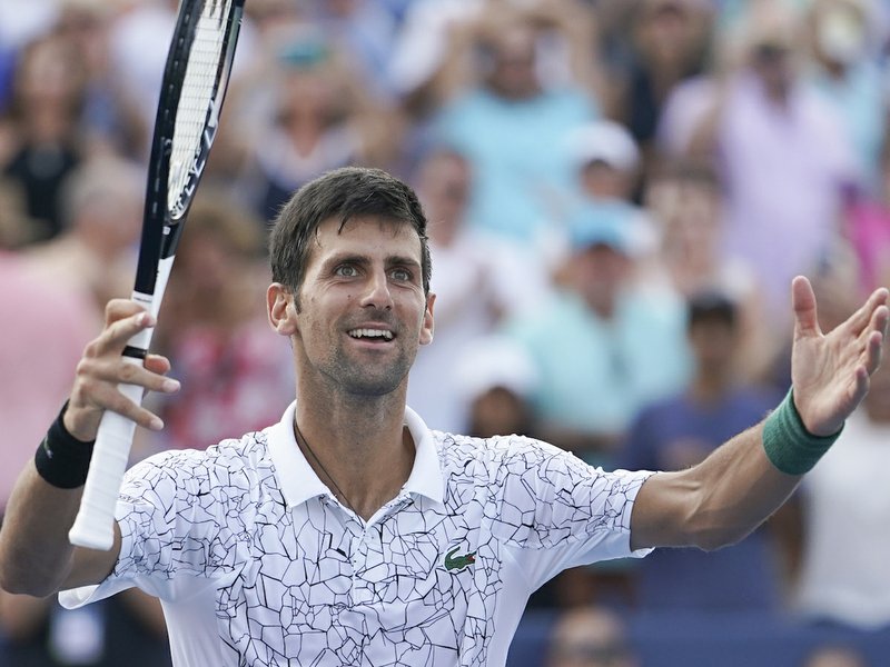 Novak Djokovic, of Serbia, reacts after defeating Roger Federer, of Switzerland, during the finals at the Western &amp; Southern Open tennis tournament, Sunday, Aug. 19, 2018, in Mason, Ohio. (AP Photo/John Minchillo)