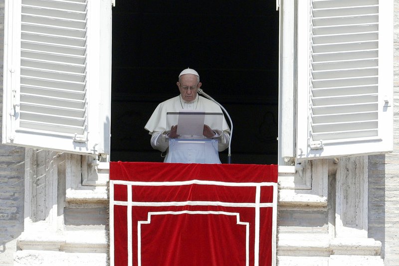 FILE - In this Sunday, Aug. 19, 2018 file photo, Pope Francis prays for the victims of the Kerala floods during the Angelus noon prayer in St.Peter's Square, at the Vatican. Pope Francis has issued a letter to Catholics around the world condemning the "crime" of priestly sexual abuse and cover-up and demanding accountability, in response to new revelations in the United States of decades of misconduct by the Catholic Church. (AP Photo/Gregorio Borgia, File)

